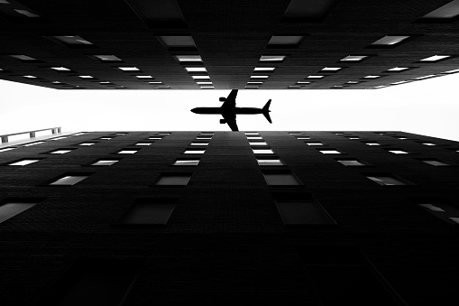plane silhouette with skyscrapers