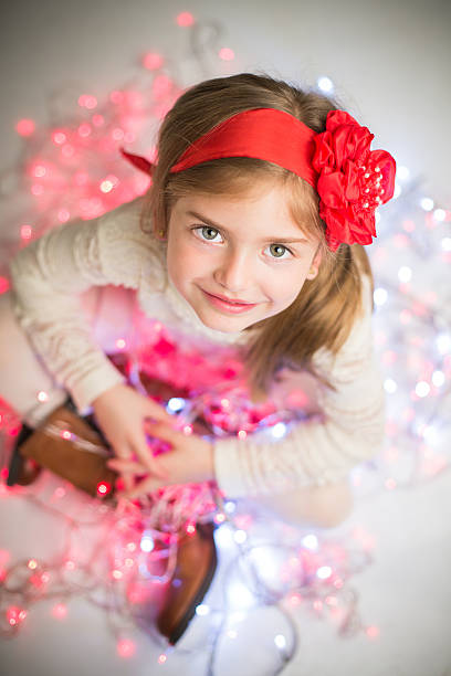 istock Smiling pretty girl on colored lights. 527049359