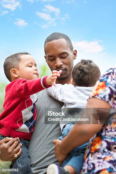 Grandmother Helps Her Single Father Son With His Twin Boys Stock Photo - Download Image Now