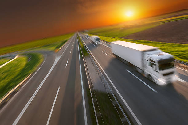 istock Motion image of new delivery trucks on the highway 527050928