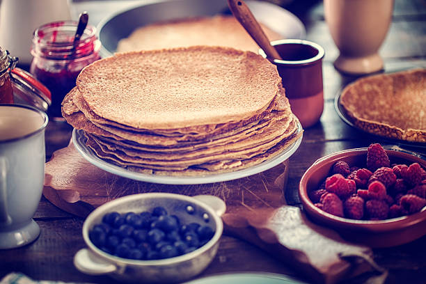 Homemade traditional dutch pannenkoeken (pancakes) with fresh berries. CNEUFOO595