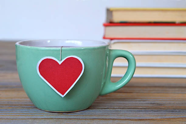 istock Cup of tea with heart shaped tea bag label 527052080