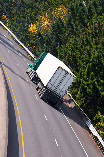istock Classic Semi truck and dry van trailer on highway 527052587