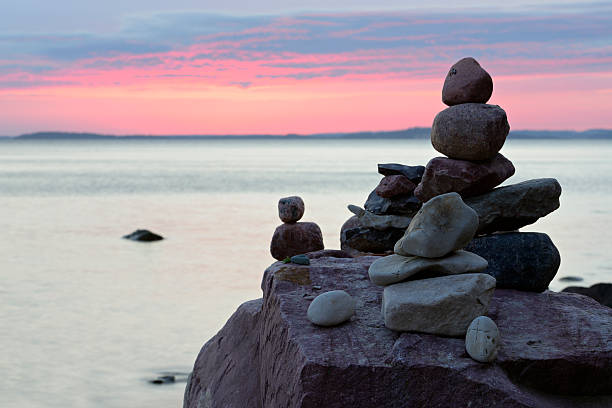 Balancing Stones on Sand Beach with Huge Boulders, Wild Rocky Coastline at Sunset, Rügen Island, Germany