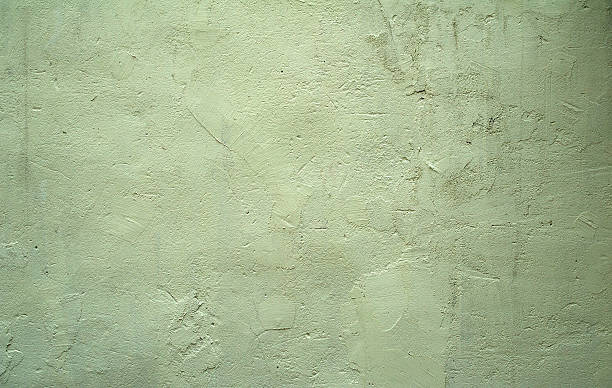 istock Texture of old wall covered with green stucco 527053497