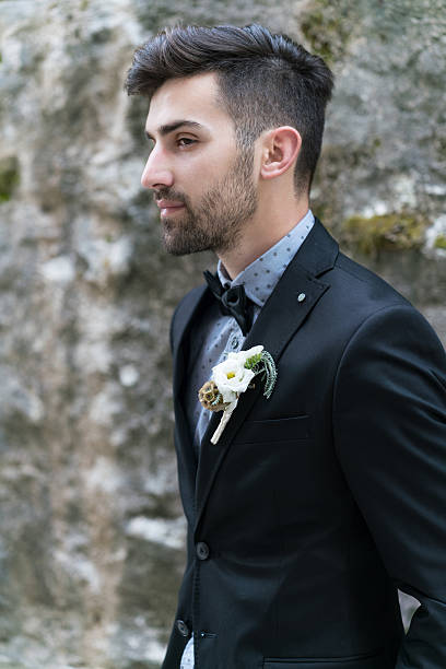 istock Sexy man in tuxedo posing 527054340