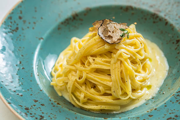 Dish of pasta with truffle Dish of pasta with truffle. selective focus. close-up tartuffo stock pictures, royalty-free photos & images