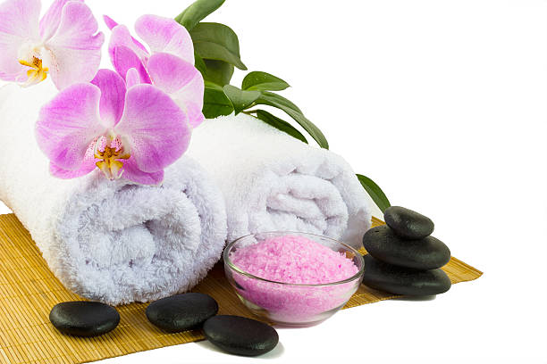 istock Spa concept with pink orchid isolated on white 527055978