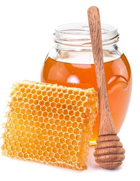 istock Jar full of fresh honey and honeycombs. 527056226