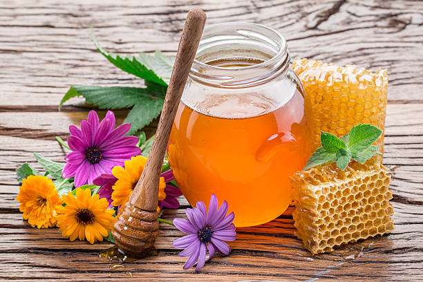 istock Jar full of fresh honey and honeycombs. 527056242