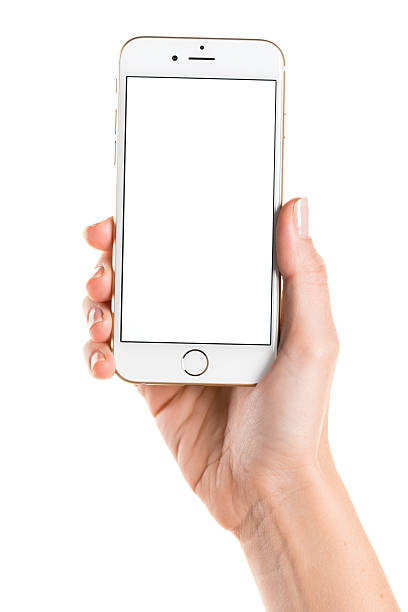 Holding gold iPhone 6 with white screen Koszalin, Poland - October 26, 2014: Close-up shot of gold iPhone 6 hand-held by woman. iPhone 6 (4.7 inches) is next generation smartphone from Apple. Device displaying blank screen - white picture. iphone hand stock pictures, royalty-free photos & images