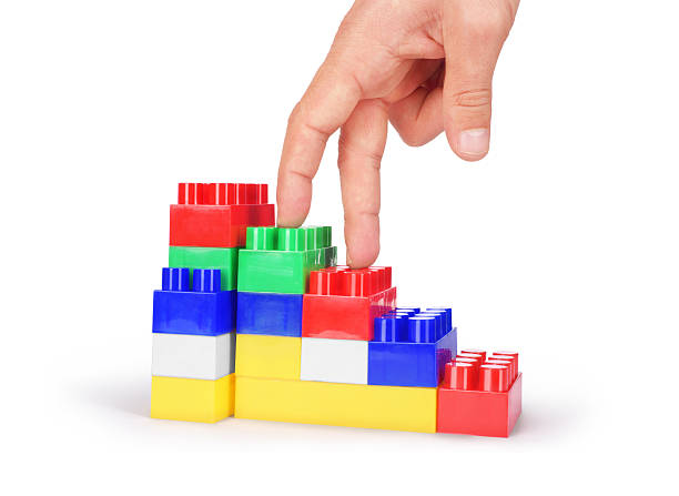 istock Hand and toy stairs 527059418