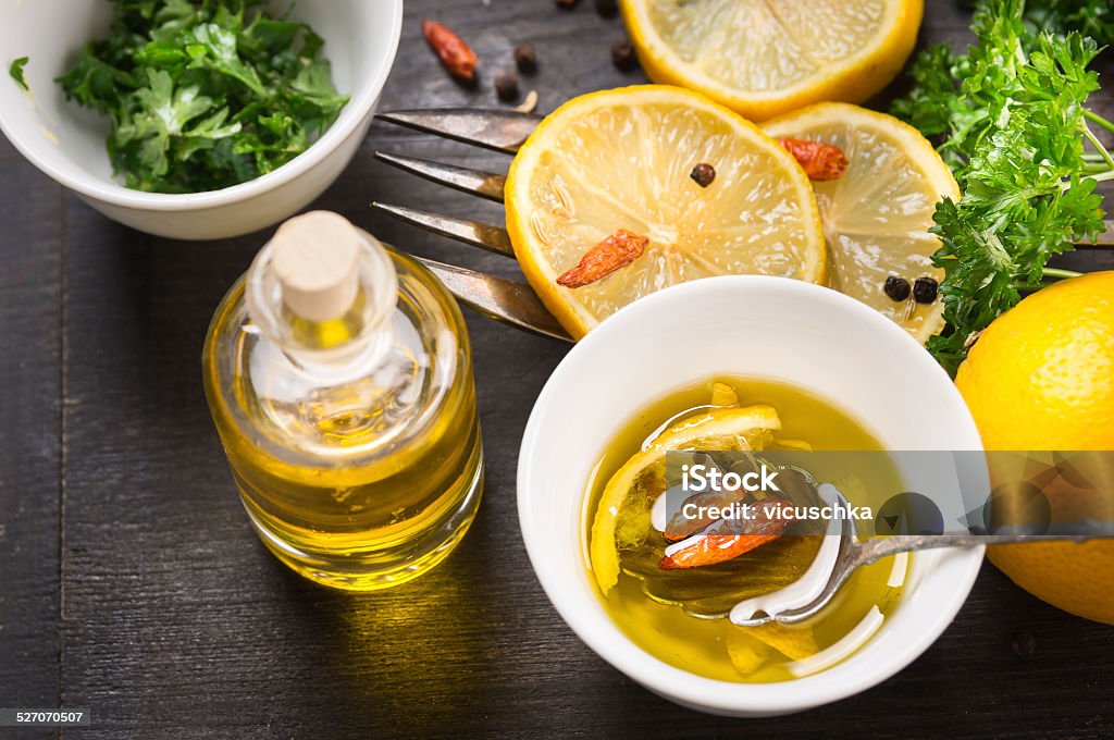 Spicy lemon oil, preparation Above Stock Photo