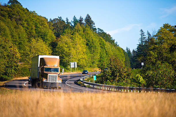 istock Powerful semi truck cornering scenic highway 527070699