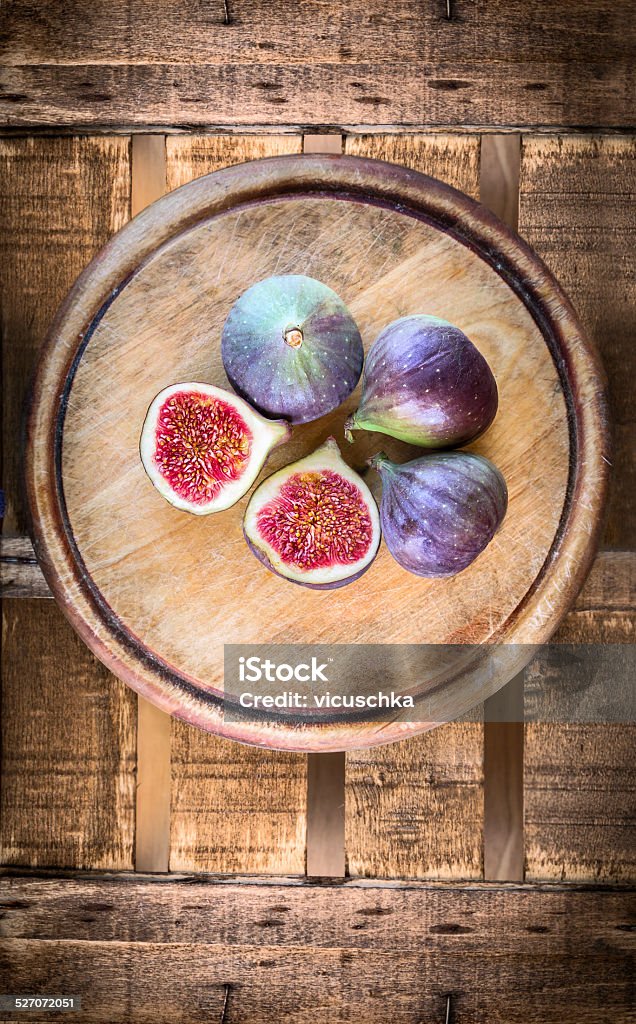Figs on old wooden, top view, food background Autumn Stock Photo