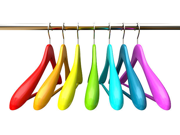 istock Colored wood hangers isolated on the white background 527073423