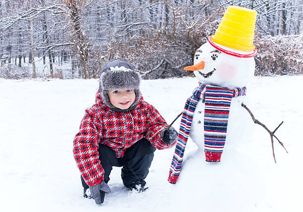 istock Winter fun! My friend snowman and me. 527074825