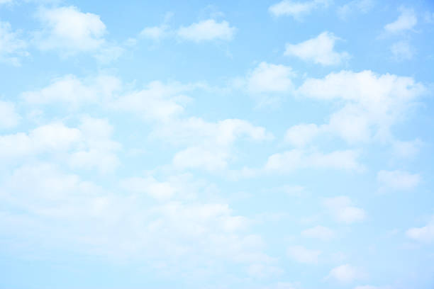 Light blue sky with clouds stock photo