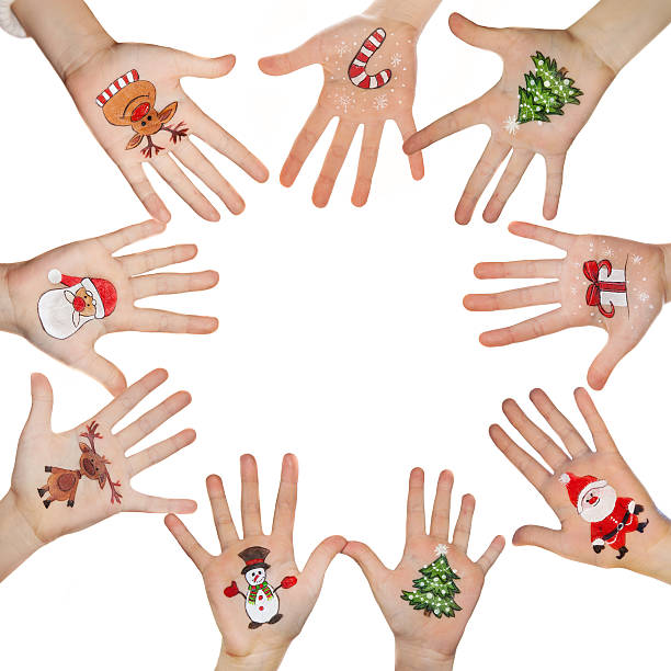 istock Kid's hands with painted Christmas symbol 527088877