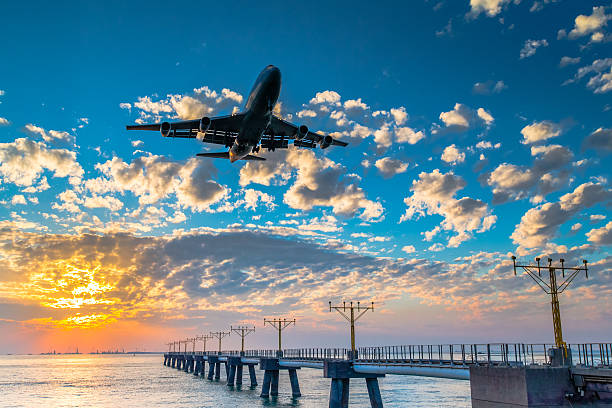 istock Airplane  landing at sunset 527089023
