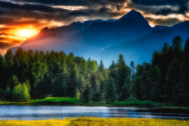 istock mountain lake with the sun in the clouds 527092991