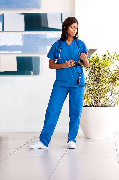 Young Woman Hispanic Doctor Nurse In Office Stock Photo - Download Image  Now - Nurse, Assistant, Healthcare And Medicine - iStock