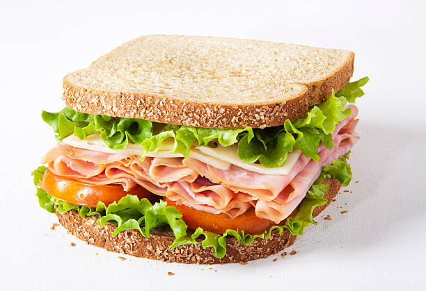 sandwich al prosciutto - portion turkey sandwich close up foto e immagini stock