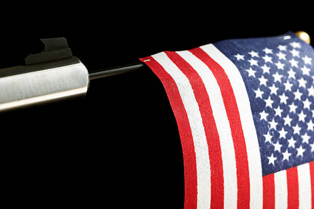 istock Gun Barrel and American Flag 527116957