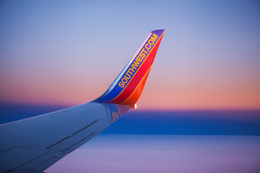 Orlando, Florida, USA - December 2, 2013: A curved winglet with the Southwest.com web site address on the wing of a Boeing 737 airplane operated by Southwest Airlines.