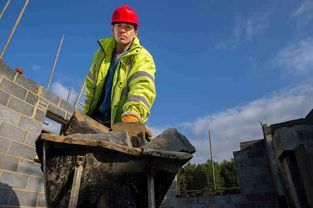 Stacking Builders 690+ Builder Stacking Bricks Stock Photos, Pictures & Royalty-Free ...