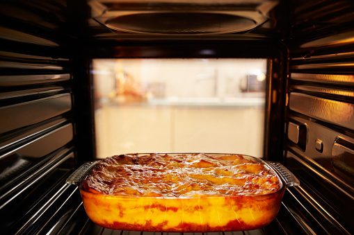 Dish Of Lasagne Cooking Inside Oven
