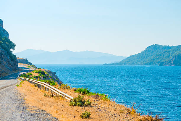 istock meandering mountain highway runs along the sea 527136995