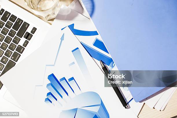 Laptop And Chart On Desk Stock Photo - Download Image Now - Business, Business Finance and Industry, Chart