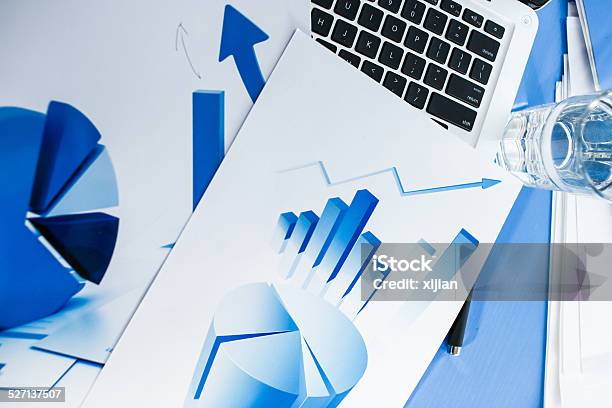 Laptop And Chart On Desk Stock Photo - Download Image Now - Business, Business Finance and Industry, Chart