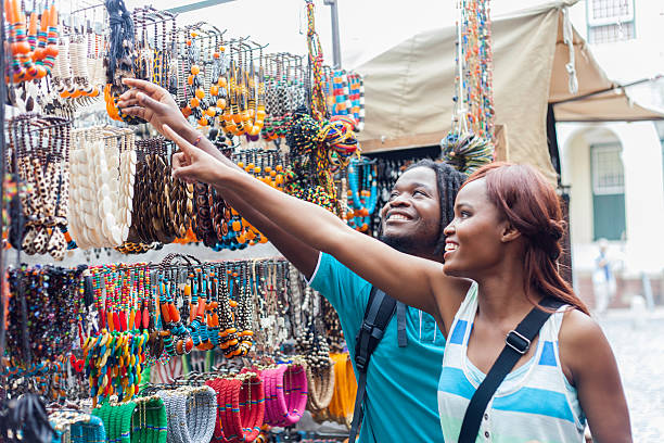 istock African male helping his girlfriend choose a necklace. 527138593