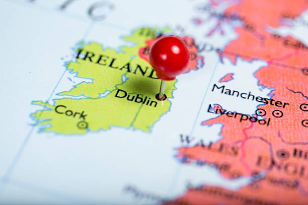 Red push pin on map of Ireland Map of Europe with a round red push pin placed on the city of Dublin dublin republic of ireland photos stock pictures, royalty-free photos & images