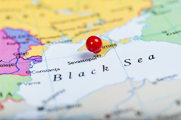 Red push pin on map of Ukraine Map of Europe with a round red push pin placed on the city of Sevastopol on Crimea crimea photos stock pictures, royalty-free photos & images