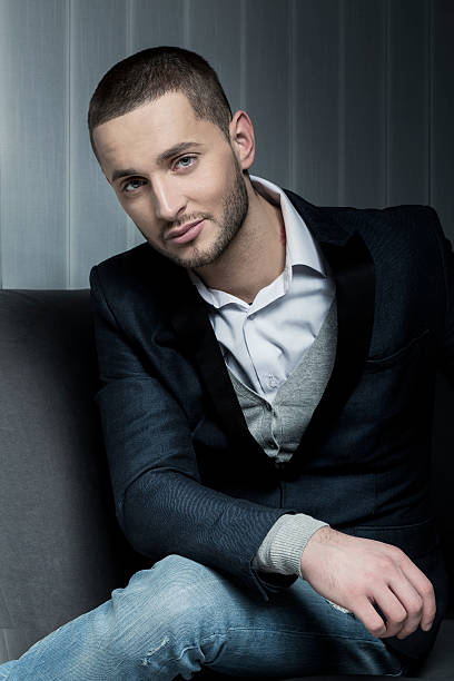 istock young business man sitting on a sofa 527167961