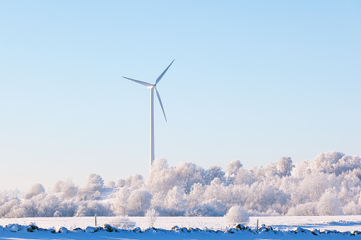 Winter landscape with wind turbine