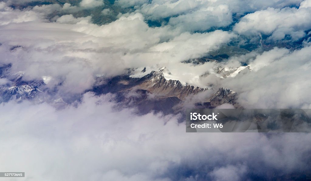 Mountains in the clouds Mountains in the clouds， in Tibethttps://lh5.googleusercontent.com/-tpvJ64X4LmY/VMUQwuBJZOI/AAAAAAAABAA/4xrt9UufxvI/s380/banner_Tibet.png Adventure Stock Photo