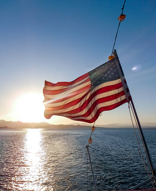 istock American Flag at Sunset 527195659