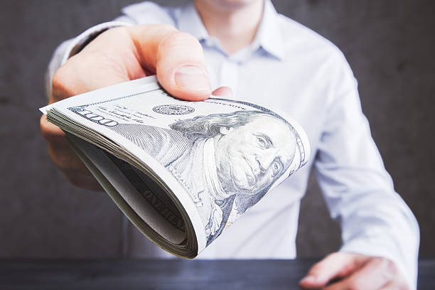 istock Handing money concrete 527211338