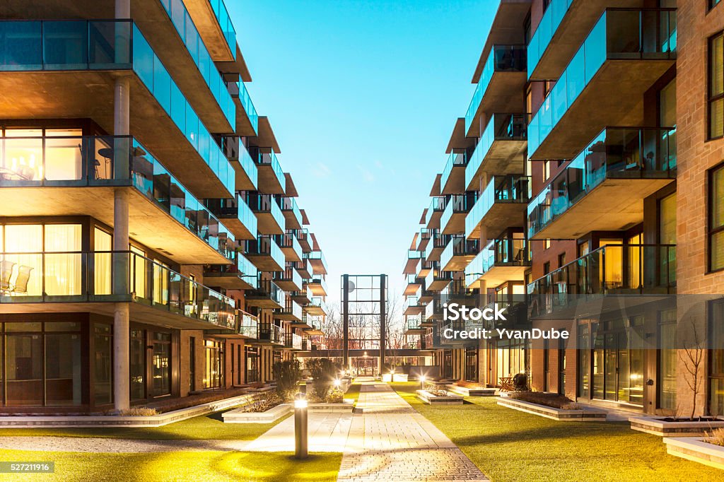 lifestyle apartments at dusk Balconies of a modern luxury apartments with a blue sky Apartment Stock Photo