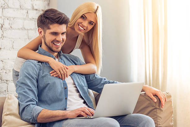 istock Beautiful couple at home with gadget 527212478