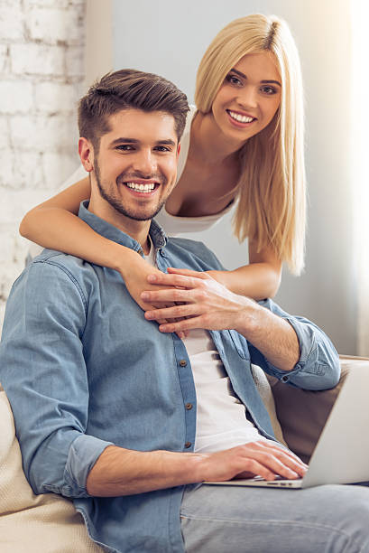 istock Beautiful couple at home with gadget 527212794