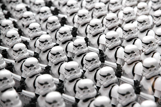 Uniform Tokyo, Japan - April 14, 2016: Toy Stormtroopers lined up in ranks. The Stormtroopers are action figures created by the Kotobukiya Toy company. Stormtroopers are enforcer characters from the Star Wars media franchise.  action figure stock pictures, royalty-free photos & images