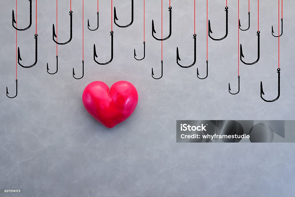 red heart with drawing of hooks red heart with drawing of hooks  love victim concept Abstract Stock Photo