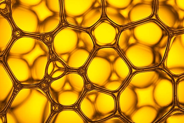 istock Yellow Soap Bubbles 4 - Water Abstract Macro Foam Background 527214466