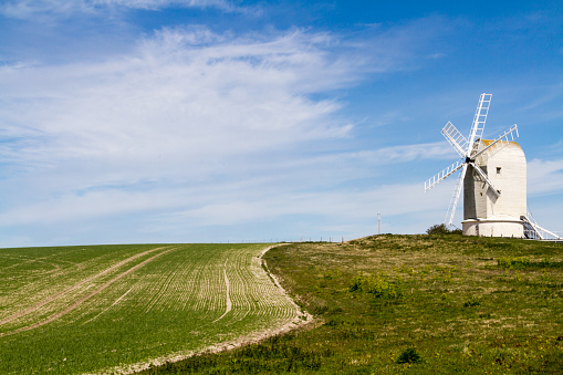 A scenic photograph of countryside and Ashcombe Windmill in Sussex, UK.