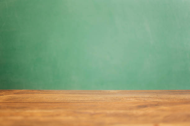 istock Back to school, educational background. Desk with green chalkboard. 527215516